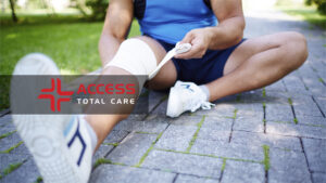 a male athlete nursing sports injuries after running