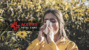 young woman outisde sneezing in tissue managing allergies with urgent care